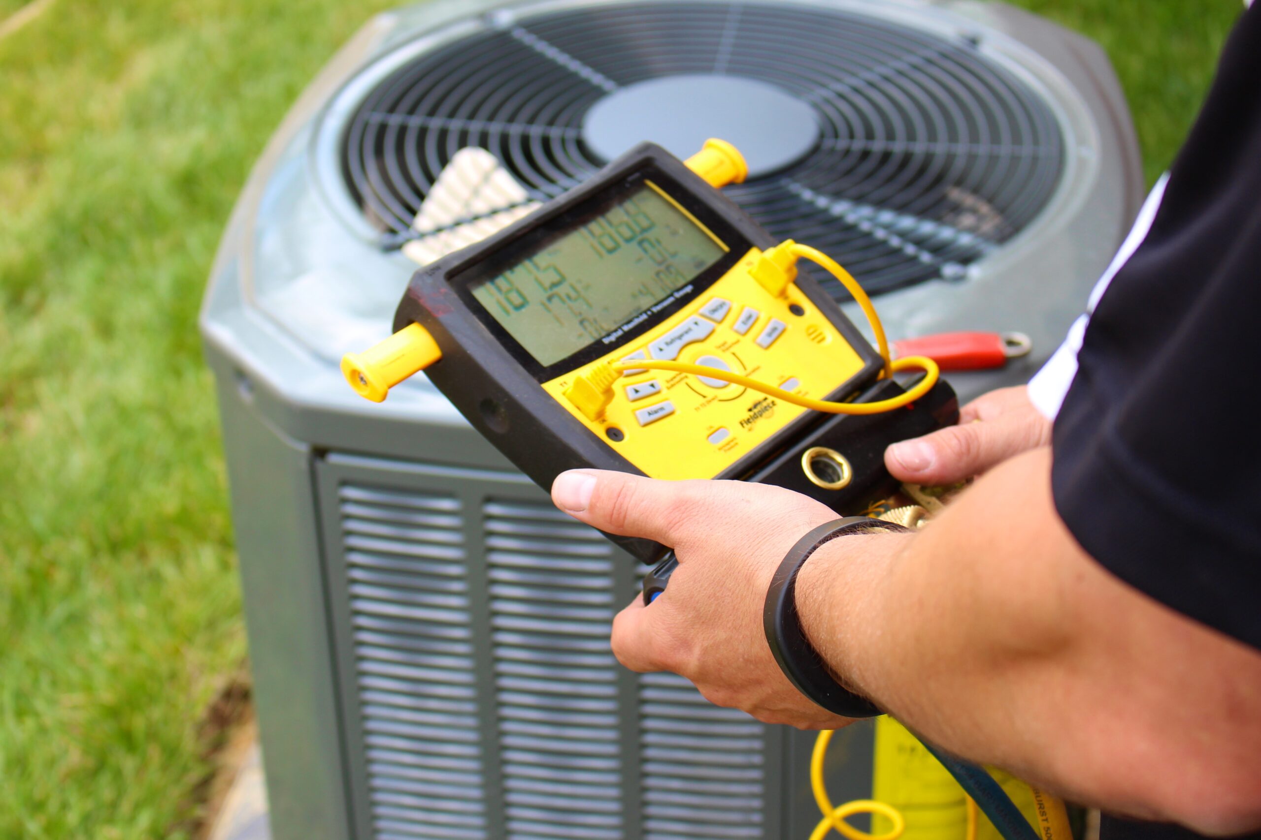 HVAC technician performing annual tune-up and maintenance