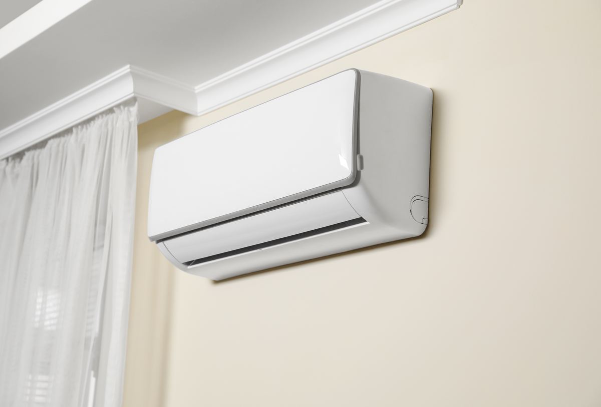 Wall-mounted ductless mini-split head conditioning a room in a northern Utah home